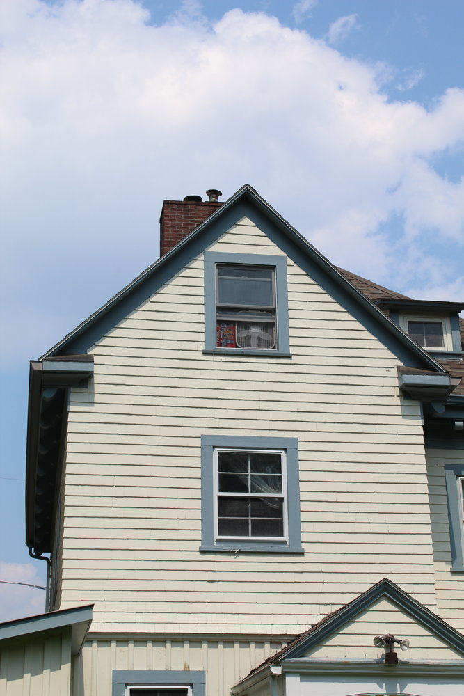 This is an easy way to ventilate a hot attic: an open window and a box fan to blow air in or out of the room.